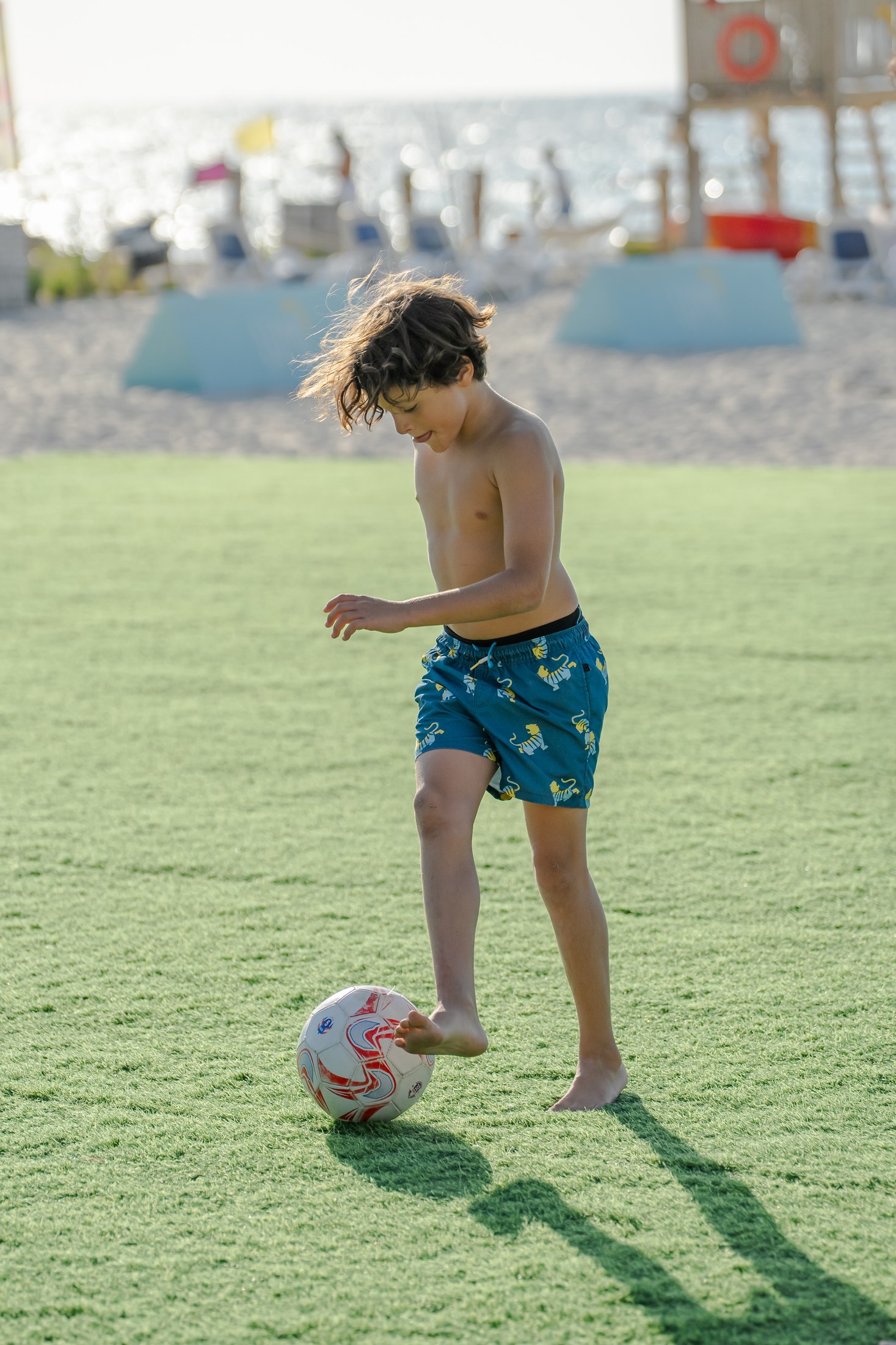 Children playing football at Umm Al Quwain Beach Hotel