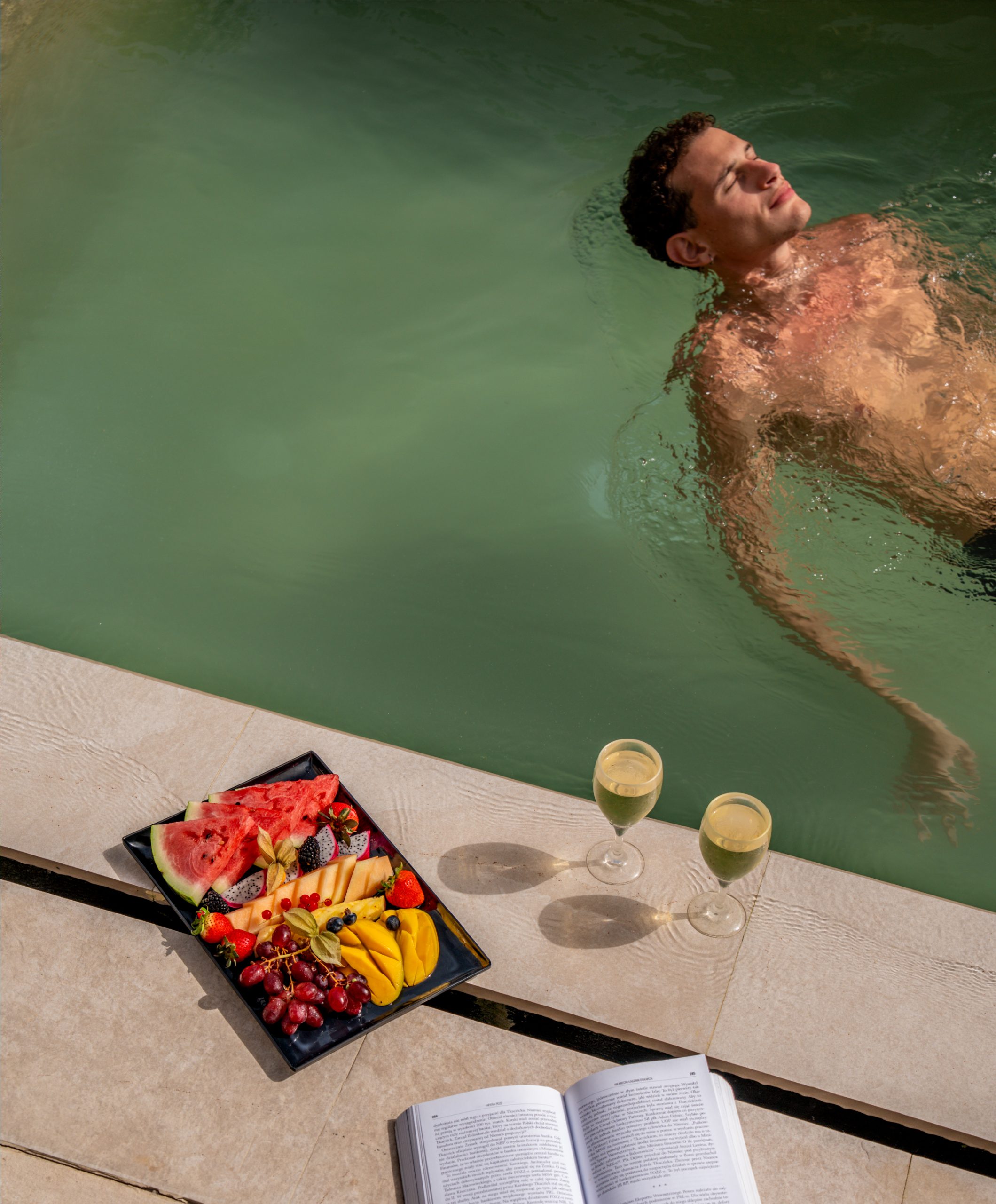 A guest cooling off in the resort pool
