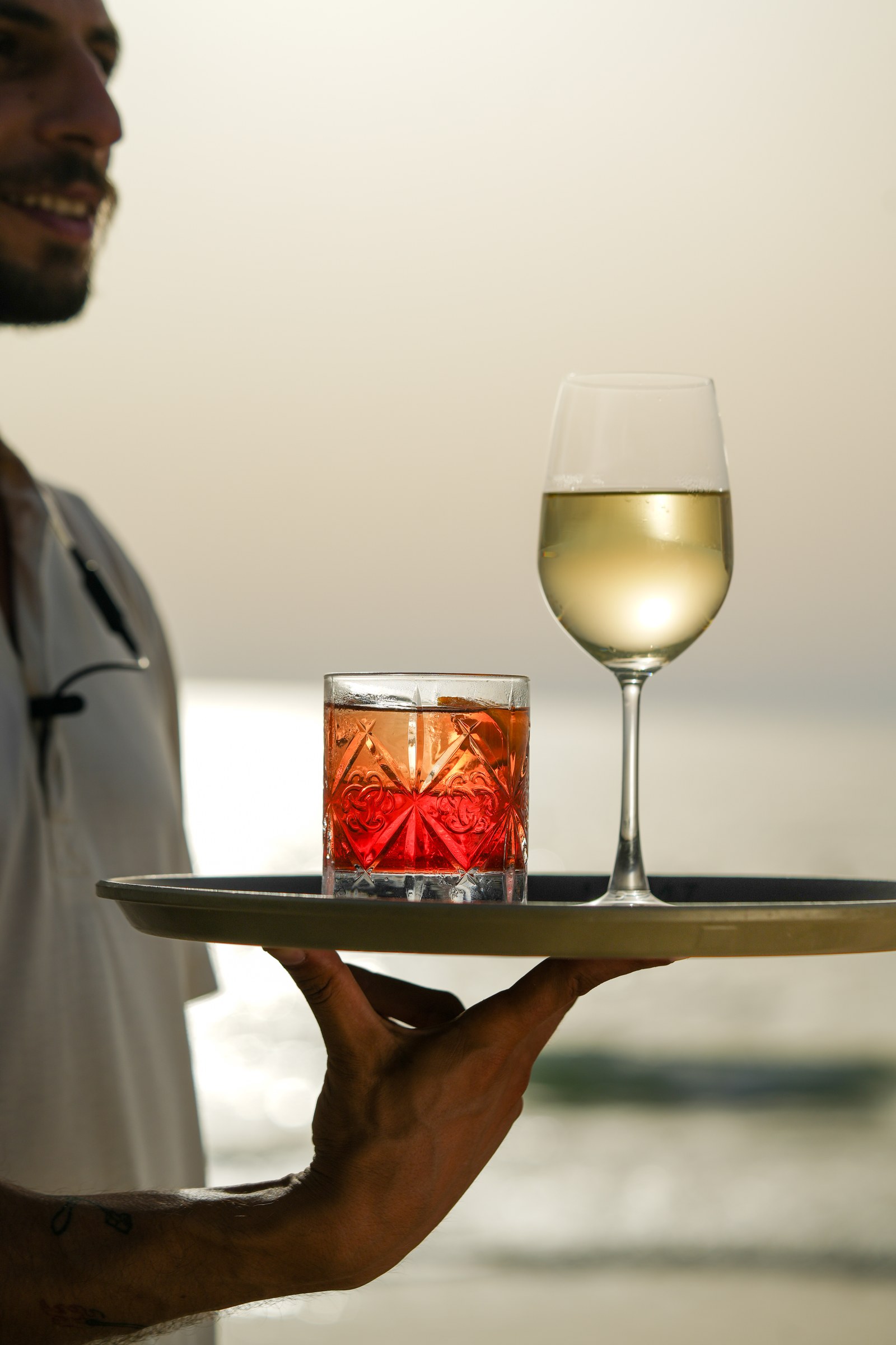 Drinks by the water at sunset
